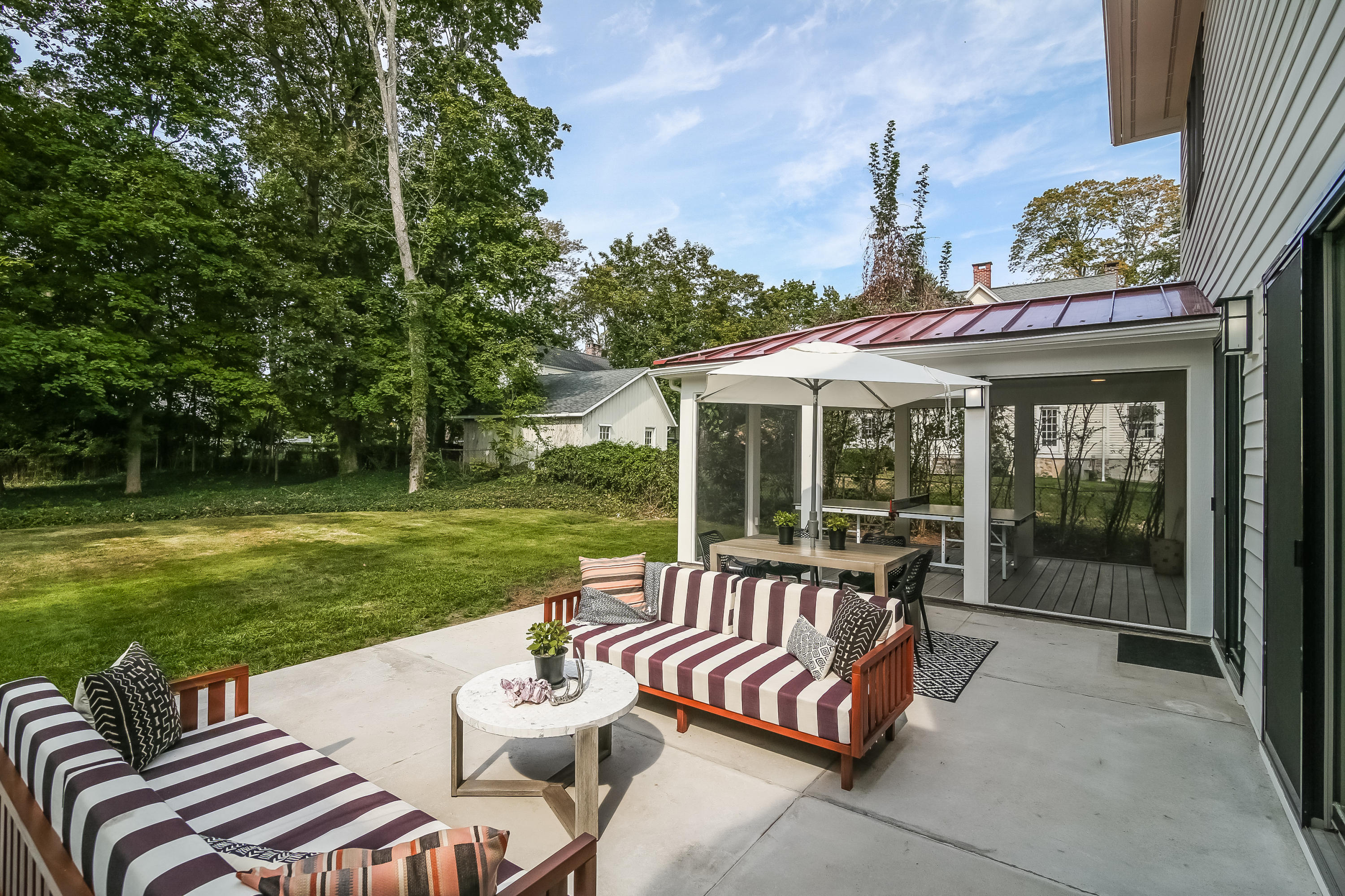 15 Marshall Ridge Road New Canaan, CT 06840 - Photo 26 of 30 a view of a patio with a table chairs and a yard