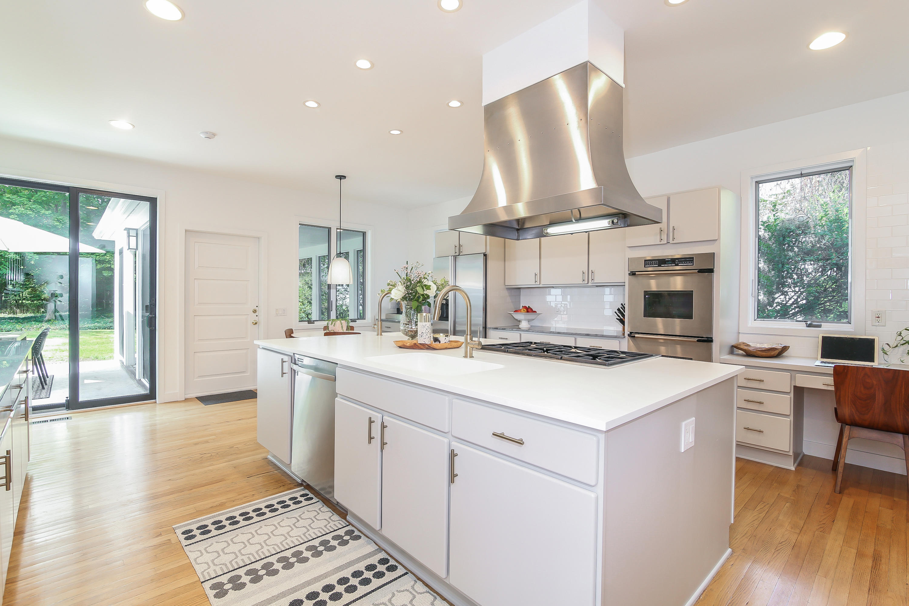 15 Marshall Ridge Road New Canaan, CT 06840 - Photo 9 of 30 a kitchen with a stove a sink and a refrigerator