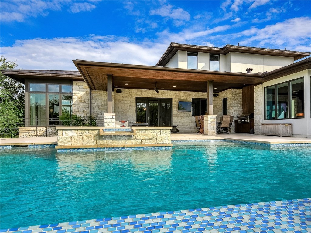 a view of a swimming pool with a patio