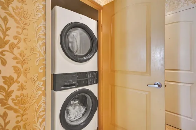 a bathroom with a sink and a washer dryer