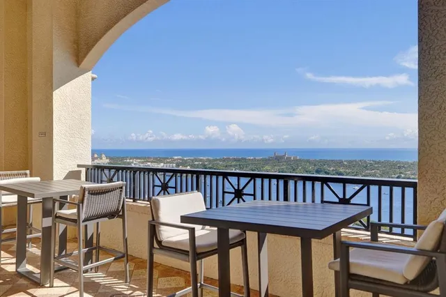 a view of a balcony with chairs