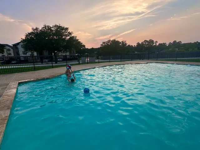 a view of a house with swimming pool and yard