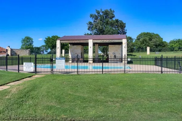 a view of a house and a backyard
