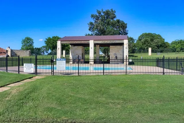 a view of a house and a backyard