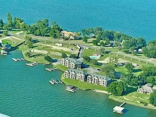 a view of a lake with a big yard