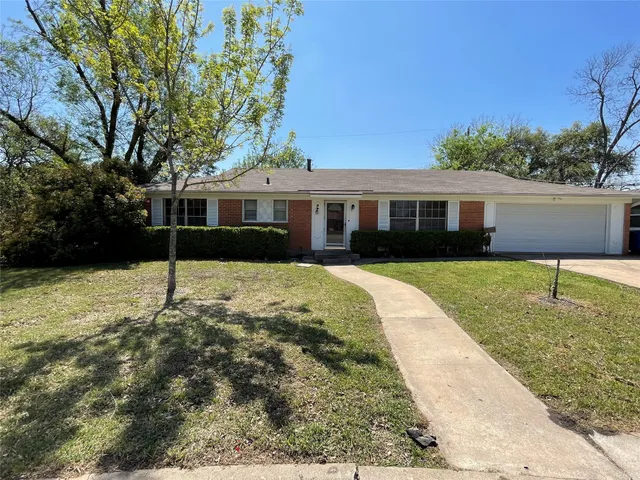 a house view with a garden space