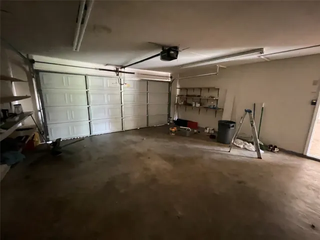 a backyard of a house with yard and garage