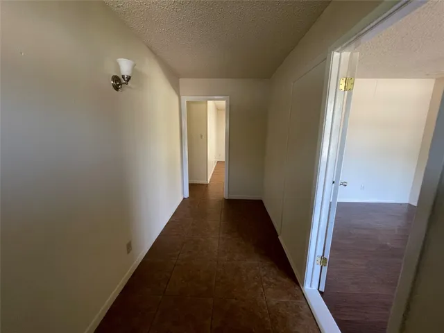 a view of a hallway with a glass door