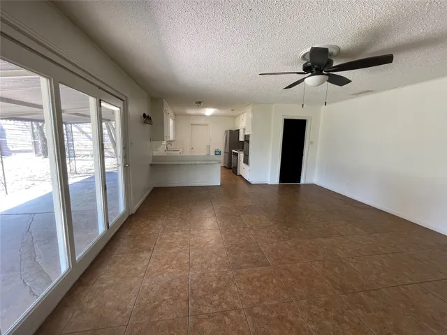 a view of a hallway with a kitchen