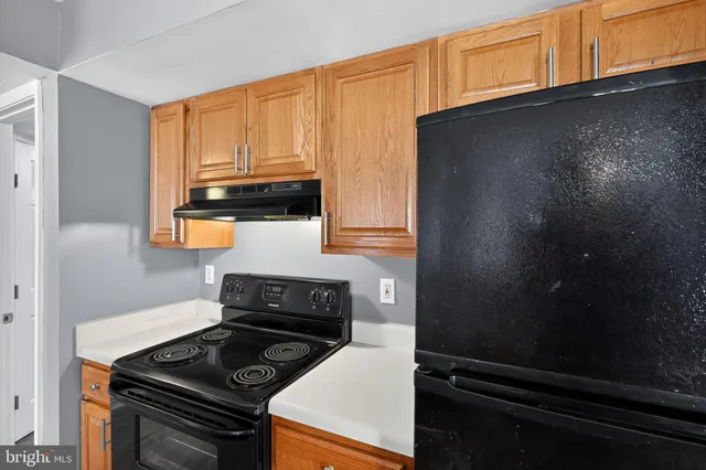 a kitchen with a stove and a microwave