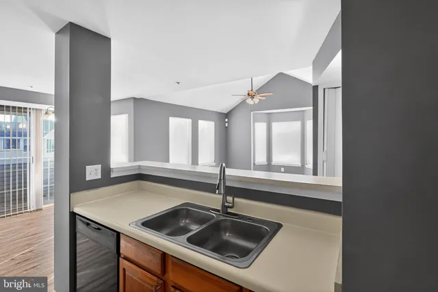 a kitchen that has a sink and a window in it