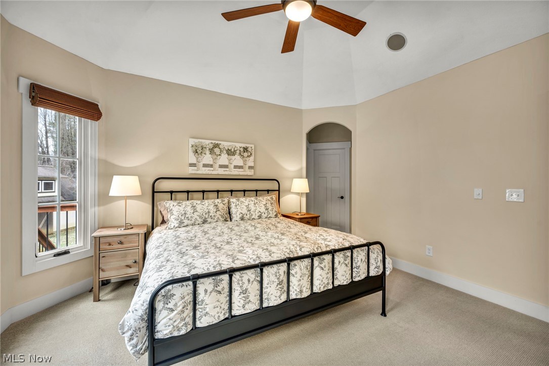 11295 Sutton Place Chardon, OH 44024 - Photo 21 of 50 Carpeted bedroom featuring ceiling fan, lofted ceiling, and arched walkways