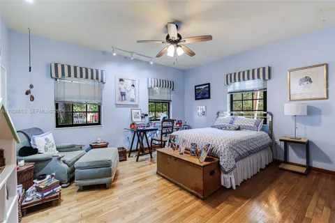 a spacious bedroom with a bed and furniture