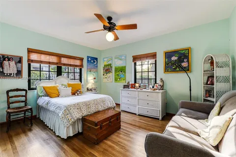 a bedroom with a bed and dresser