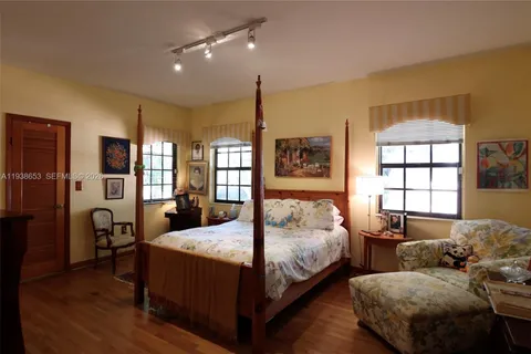 a bedroom with double bed and a window