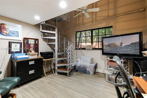 a room with wooden furniture and windows