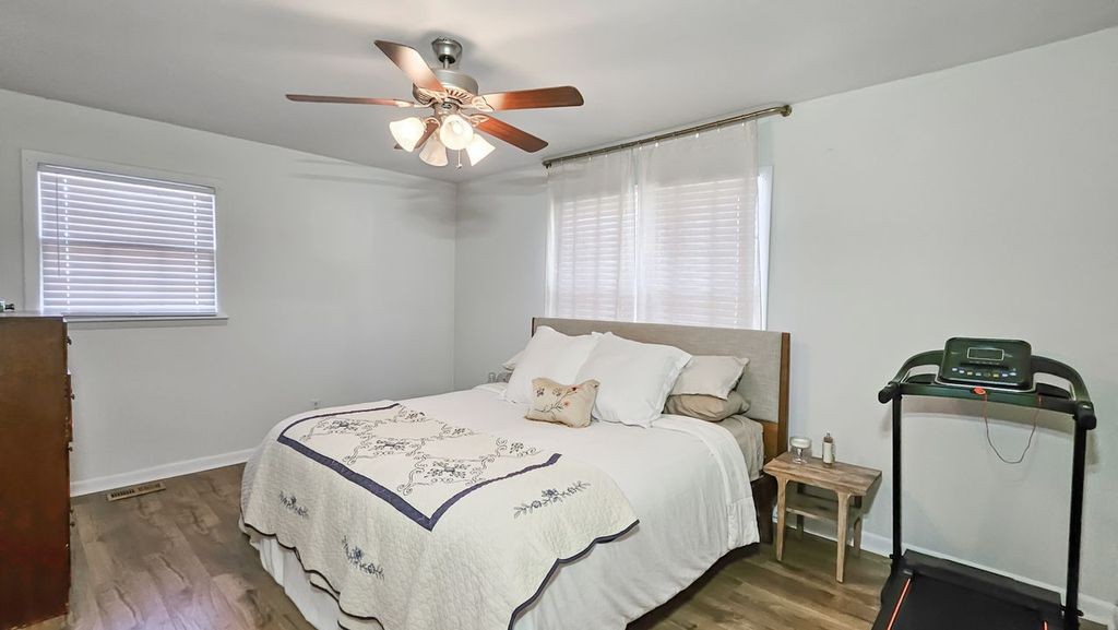 20 Tunstill Loop Road Fayetteville, TN 37334 - Photo 15 of 48 a bedroom with a bed and a chandelier