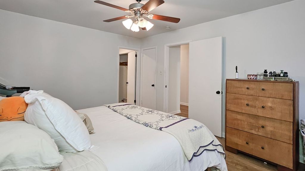 20 Tunstill Loop Road Fayetteville, TN 37334 - Photo 16 of 48 a bedroom with a bed and a chandelier
