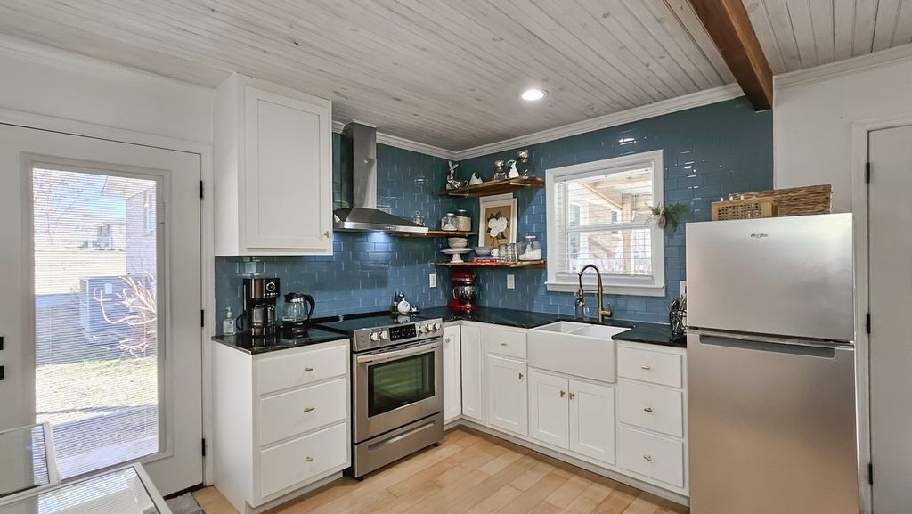 20 Tunstill Loop Road Fayetteville, TN 37334 - Photo 34 of 48 a kitchen with white cabinets and white appliances