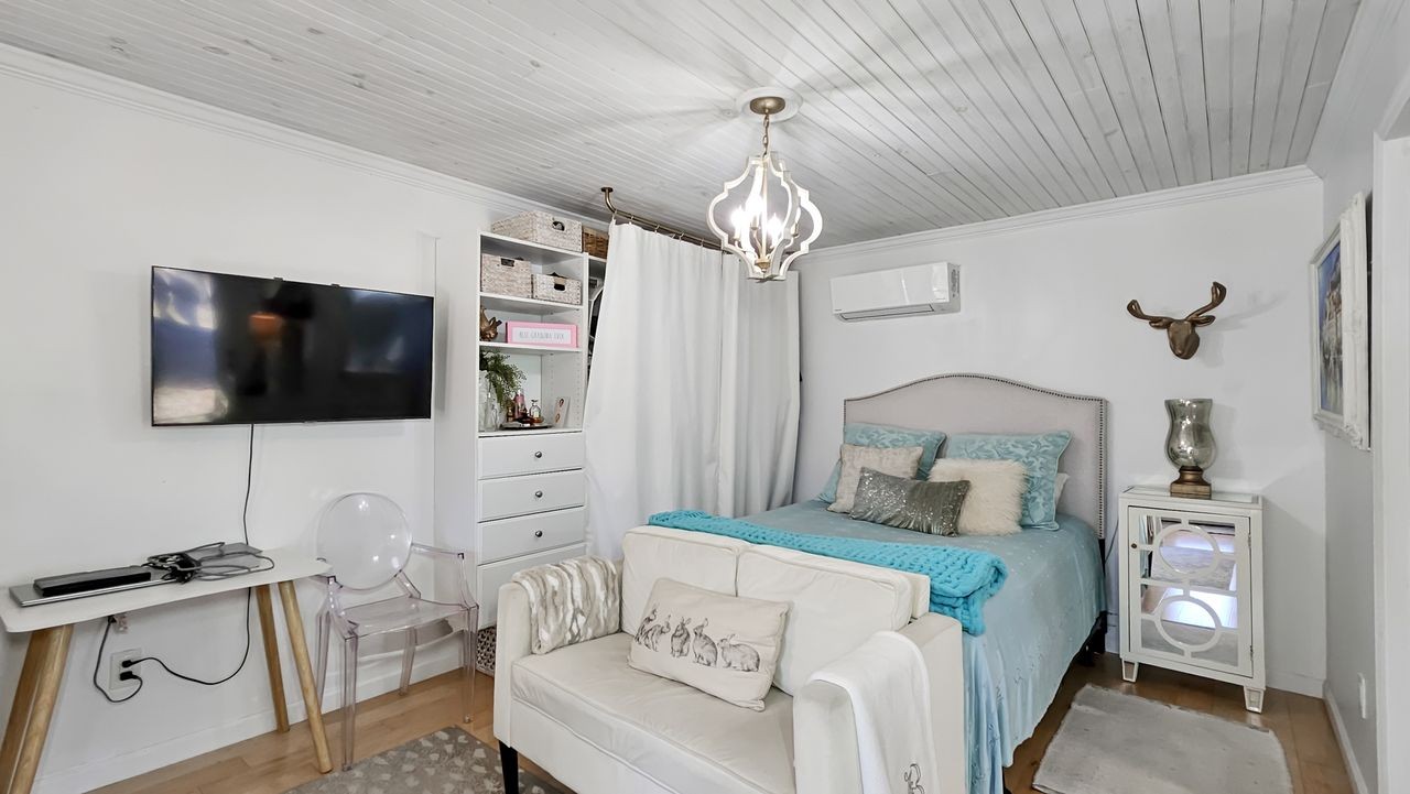 20 Tunstill Loop Road Fayetteville, TN 37334 - Photo 38 of 48 a bedroom with a bed and a flat screen tv