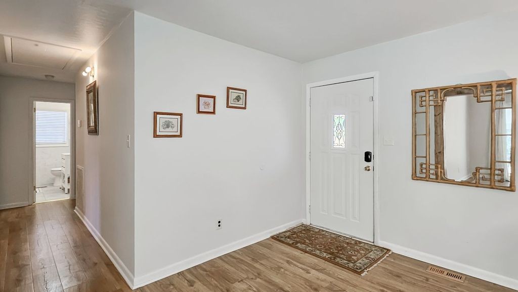 20 Tunstill Loop Road Fayetteville, TN 37334 - Photo 4 of 48 a view of a room with wooden floor and windows