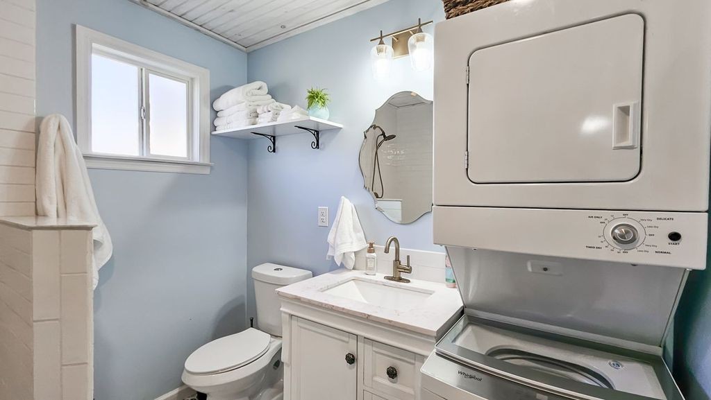 20 Tunstill Loop Road Fayetteville, TN 37334 - Photo 41 of 48 a bathroom with a sink a toilet and mirror