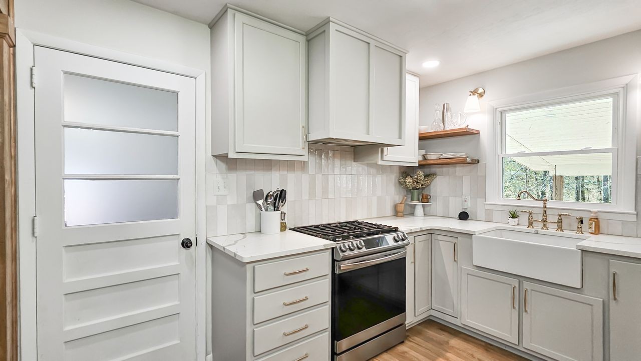20 Tunstill Loop Road Fayetteville, TN 37334 - Photo 7 of 48 a kitchen with white cabinets and appliances