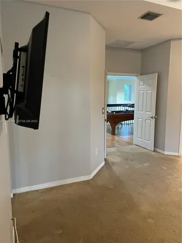 a view of a backyard with potted plants