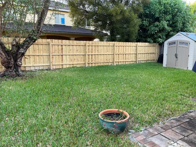 a view of a backyard with garden