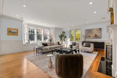 a spacious bedroom with a bed window and couch