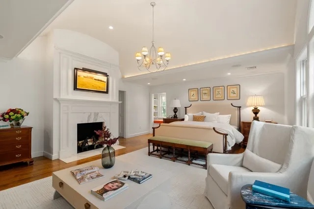 a spacious bathroom with a tub and a large window