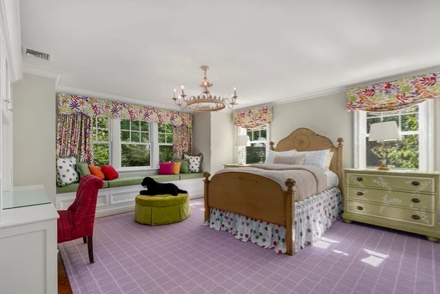 a living room with furniture a fireplace and a table