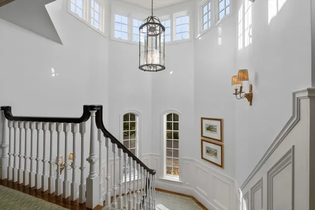 a room with gym equipment and wooden floor
