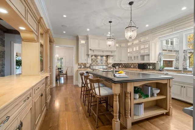 a large kitchen with lots of counter space and stainless steel appliances