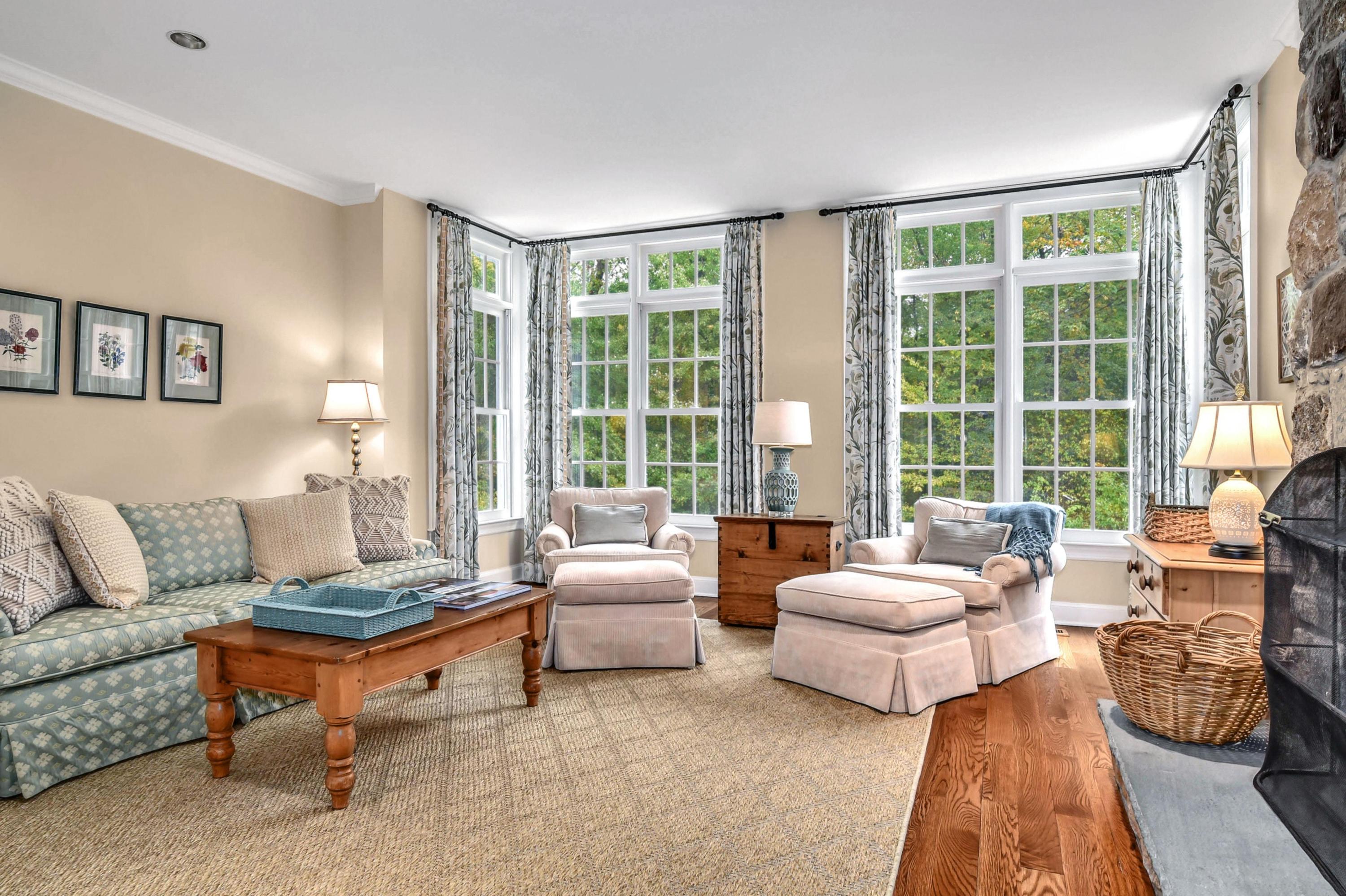 104 Christie Hill Road Darien, CT 06820 - Photo 13 of 38 a living room with furniture and a large window