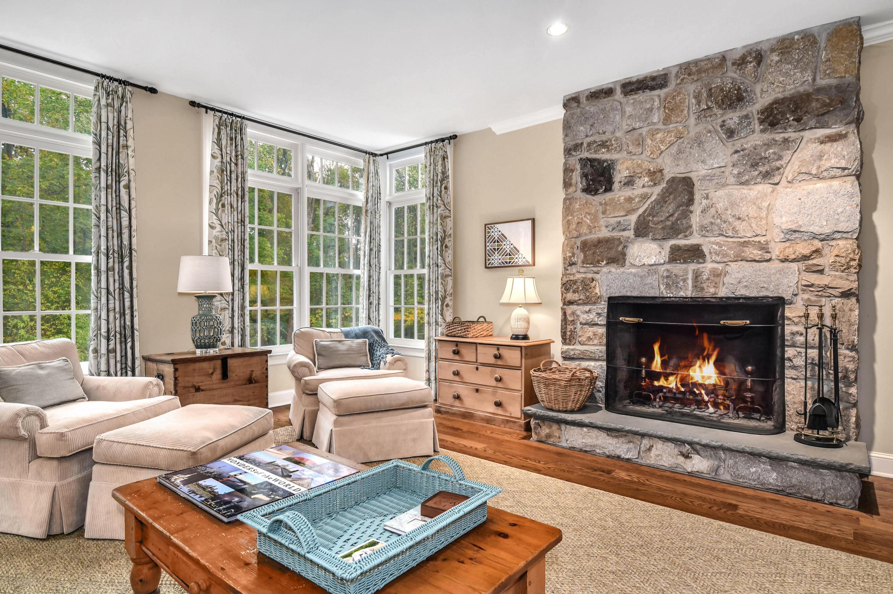 104 Christie Hill Road Darien, CT 06820 - Photo 14 of 38 a living room with furniture and a fireplace