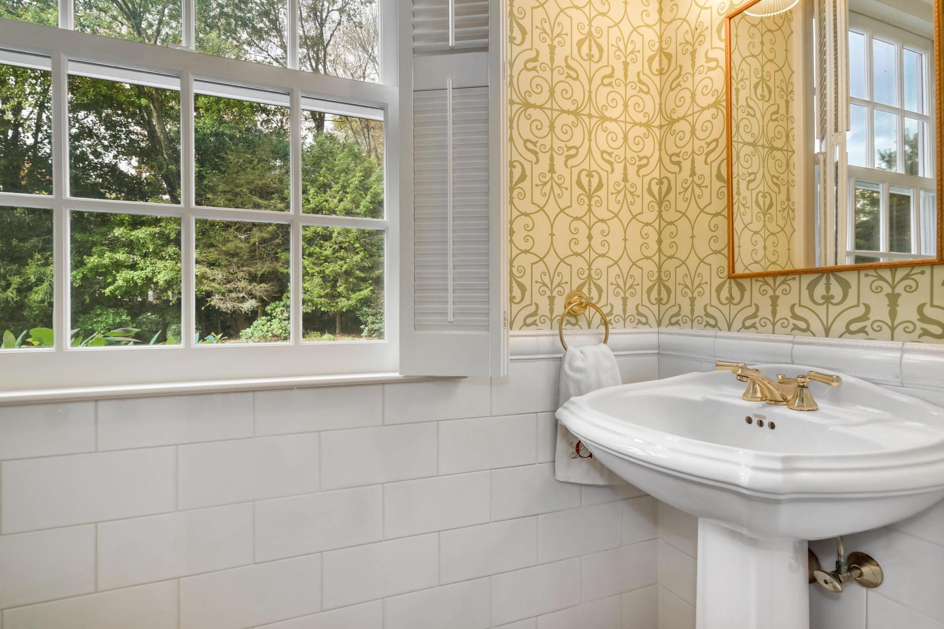 104 Christie Hill Road Darien, CT 06820 - Photo 16 of 38 a bathroom with a sink and a window