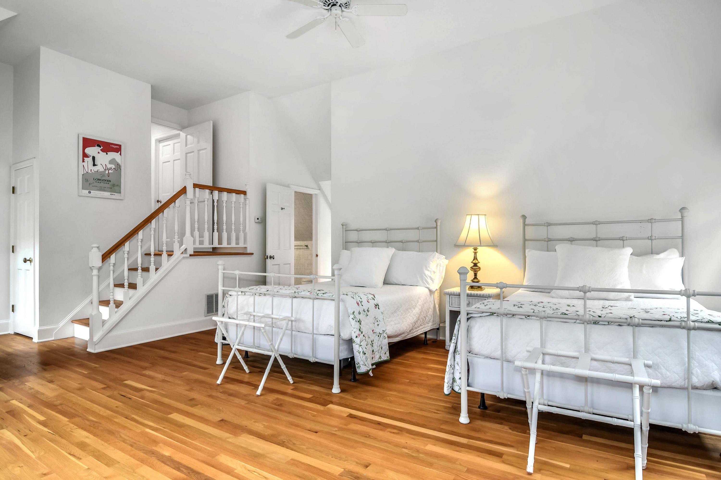 104 Christie Hill Road Darien, CT 06820 - Photo 21 of 38 a bedroom with furniture and a wooden floor