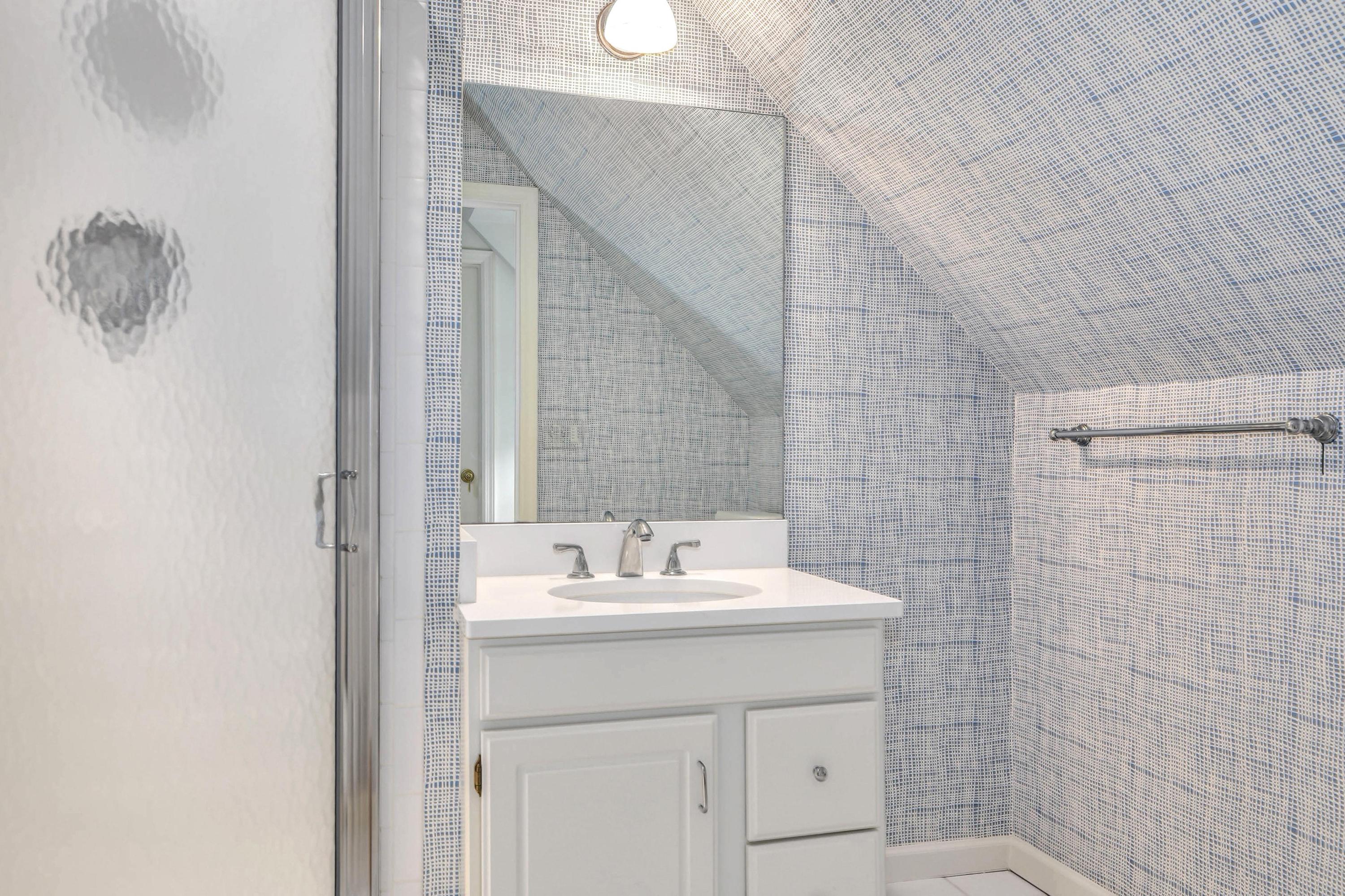104 Christie Hill Road Darien, CT 06820 - Photo 23 of 38 a bathroom with a sink and a mirror