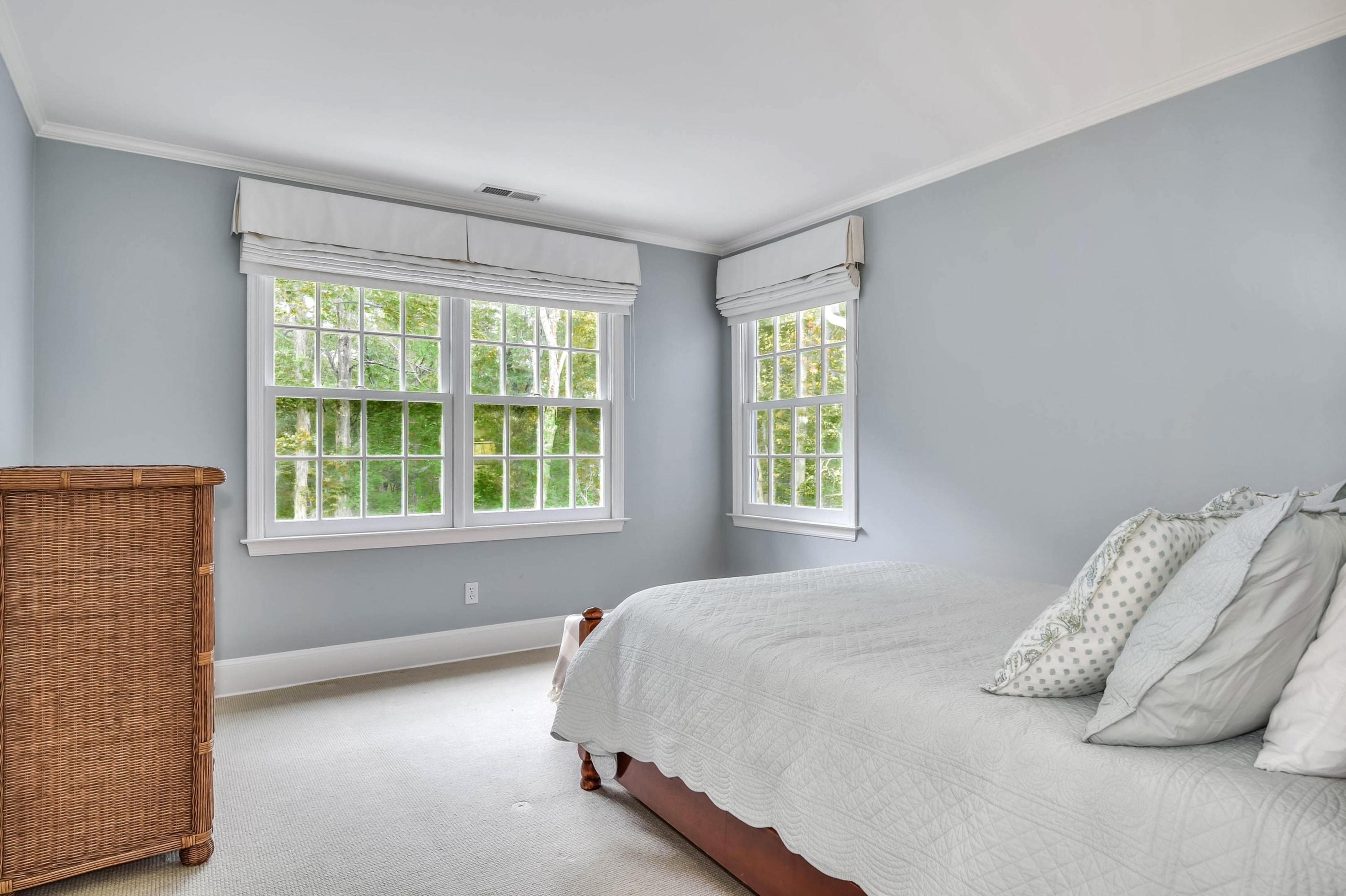 104 Christie Hill Road Darien, CT 06820 - Photo 24 of 38 a bedroom with a bed and a window