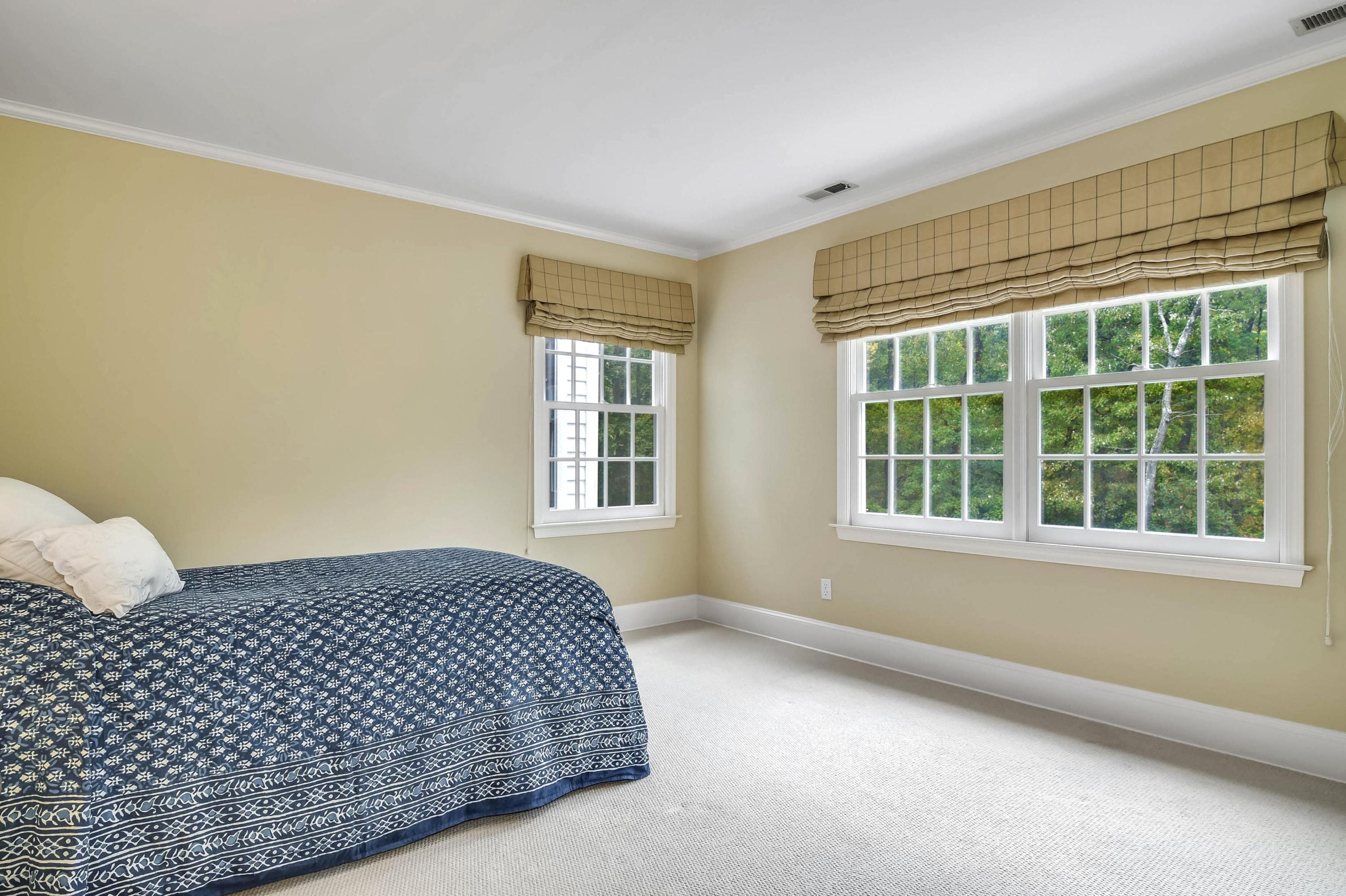 104 Christie Hill Road Darien, CT 06820 - Photo 25 of 38 a bedroom with a bed and a window