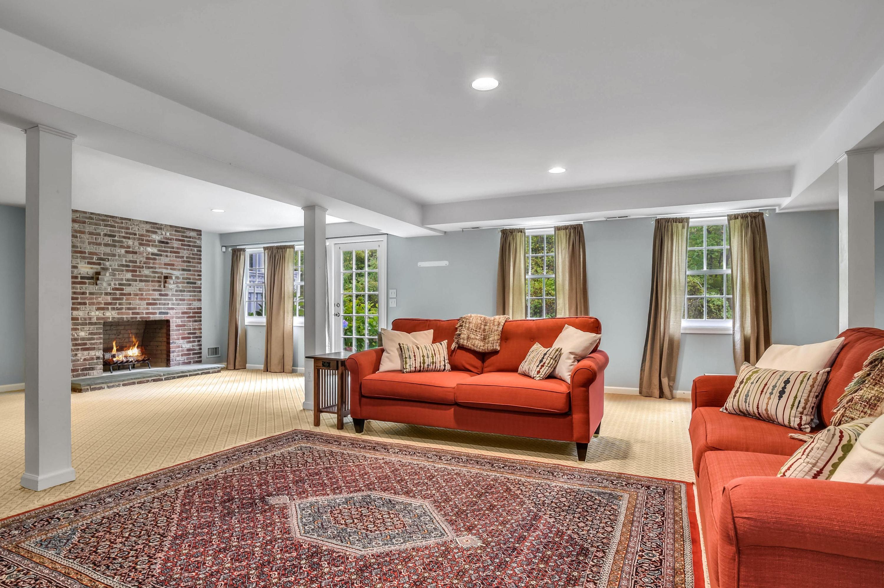 104 Christie Hill Road Darien, CT 06820 - Photo 29 of 38 a living room with furniture and a fireplace