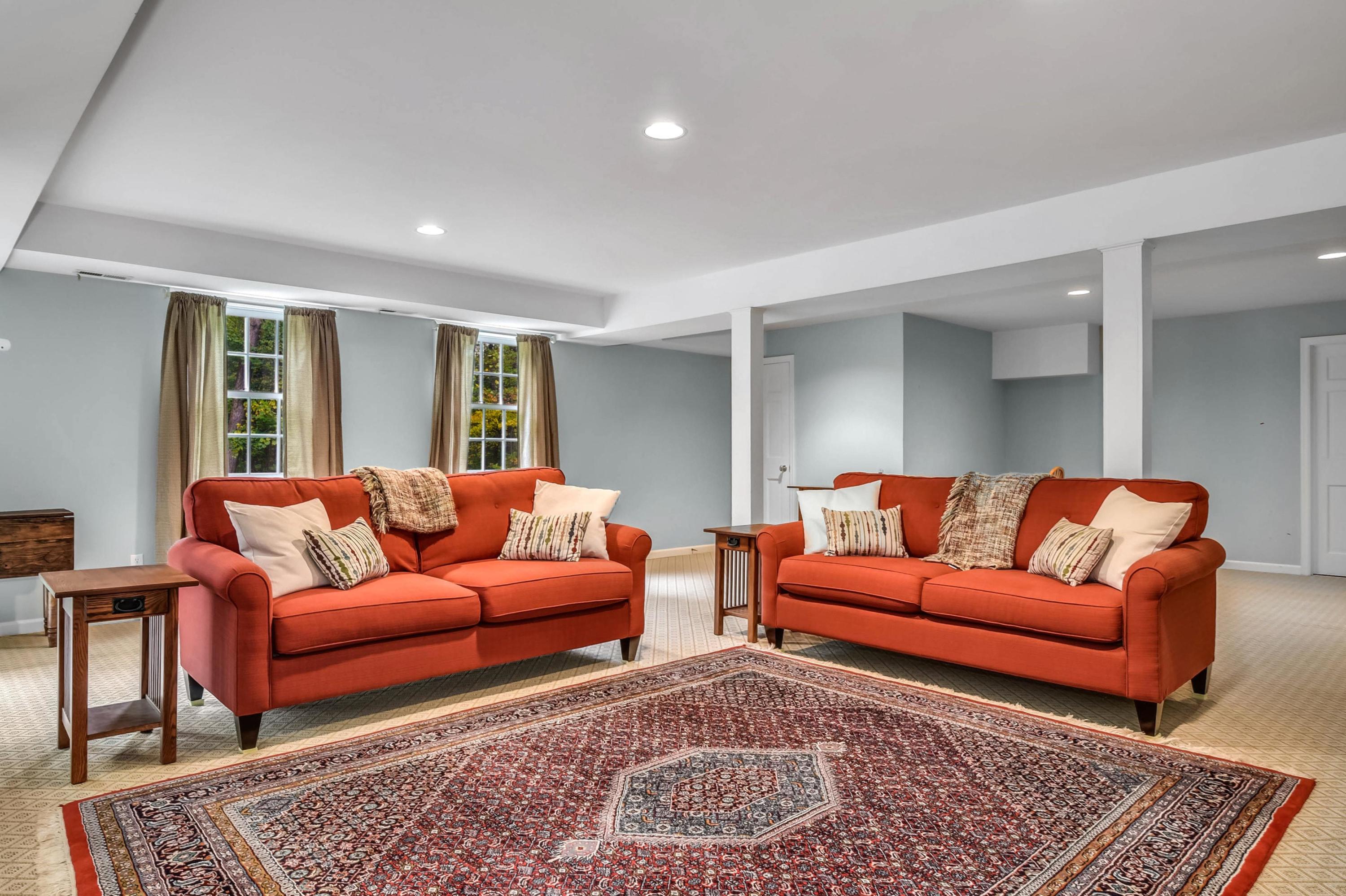 104 Christie Hill Road Darien, CT 06820 - Photo 30 of 38 a living room with furniture and a rug