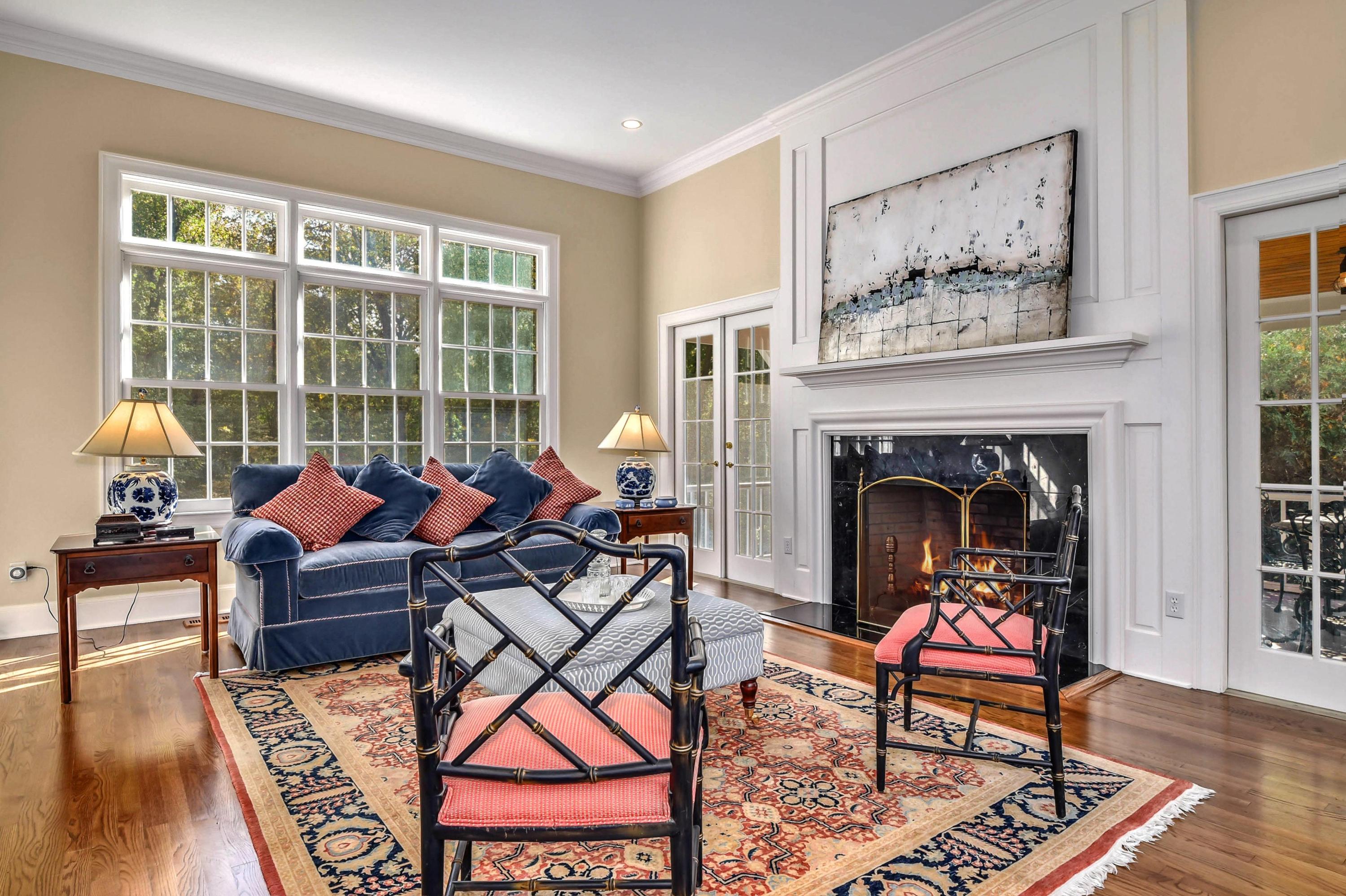 104 Christie Hill Road Darien, CT 06820 - Photo 3 of 38 a living room with furniture a rug and a fireplace