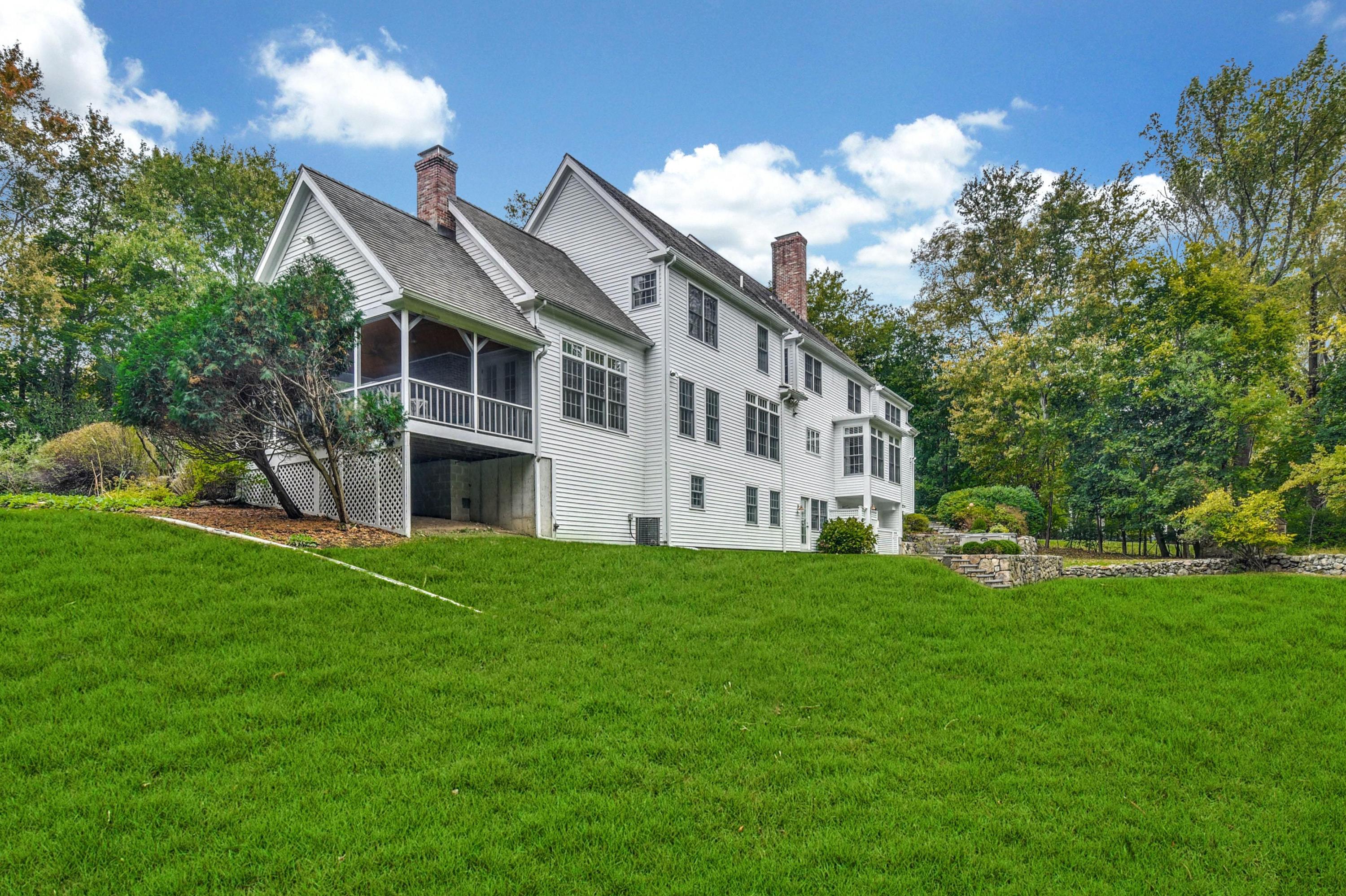 104 Christie Hill Road Darien, CT 06820 - Photo 33 of 38 a view of a building with a yard