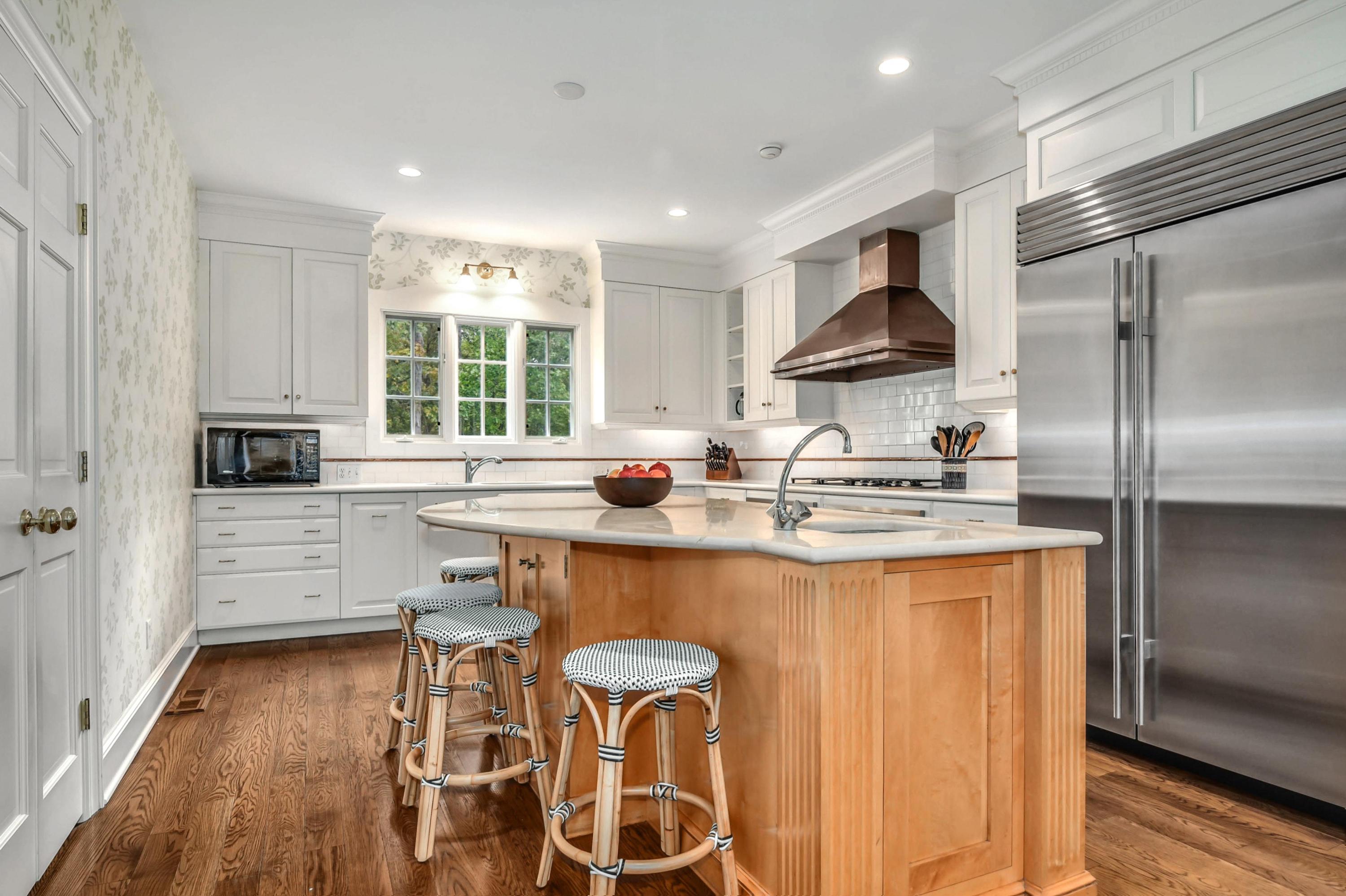 104 Christie Hill Road Darien, CT 06820 - Photo 8 of 38 a kitchen with stainless steel appliances granite countertop a sink stove and refrigerator