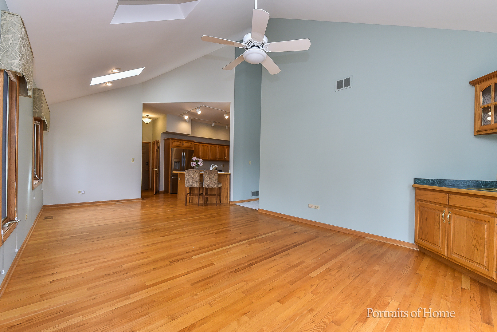 11 Merrimack Court Bolingbrook, IL 60440 - Photo 17 of 46 a view of an empty room with window and a kitchen