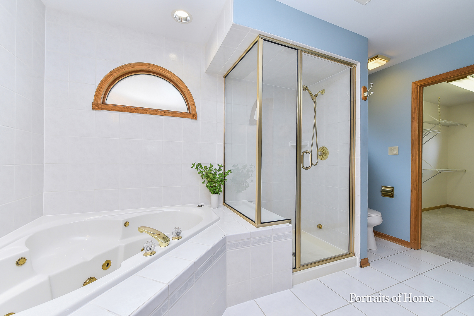 11 Merrimack Court Bolingbrook, IL 60440 - Photo 21 of 46 a bathroom with a tub a sink and a shower