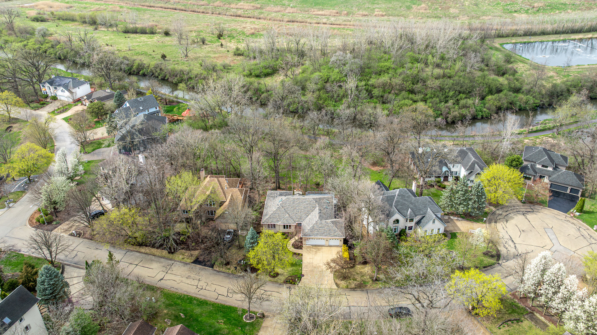 11 Merrimack Court Bolingbrook, IL 60440 - Photo 41 of 46 a view of a lake with large trees