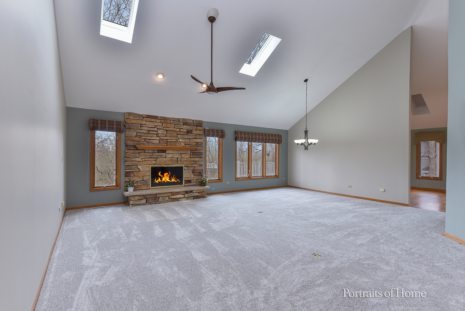 11 Merrimack Court Bolingbrook, IL 60440 - Photo 7 of 46 an empty room with windows and fireplace
